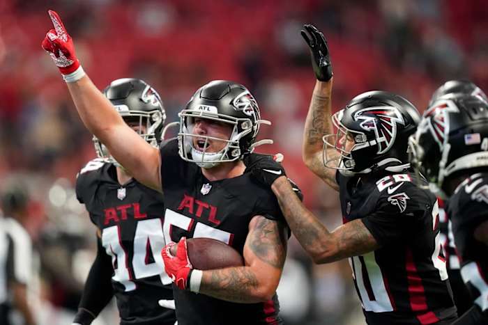 Atlanta Falcons linebacker Nathan Landman celebrates with teammates after forcing a turnover.